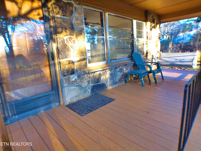 wooden terrace featuring covered porch