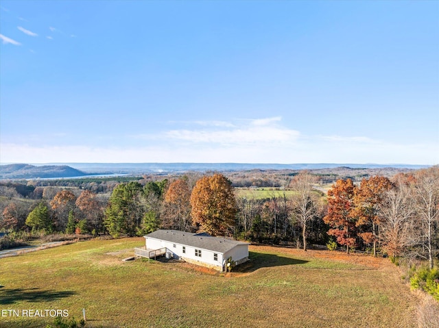 birds eye view of property featuring a mountain view and a rural view