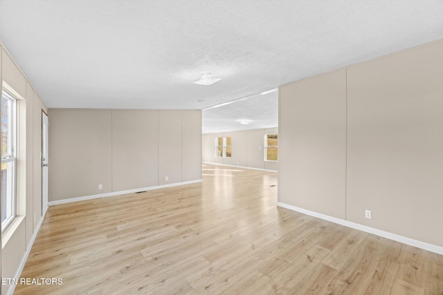1202 Greenpond Rd, Decatur, TN 37322 - spare room with light hardwood / wood-style floors and a textured ceiling