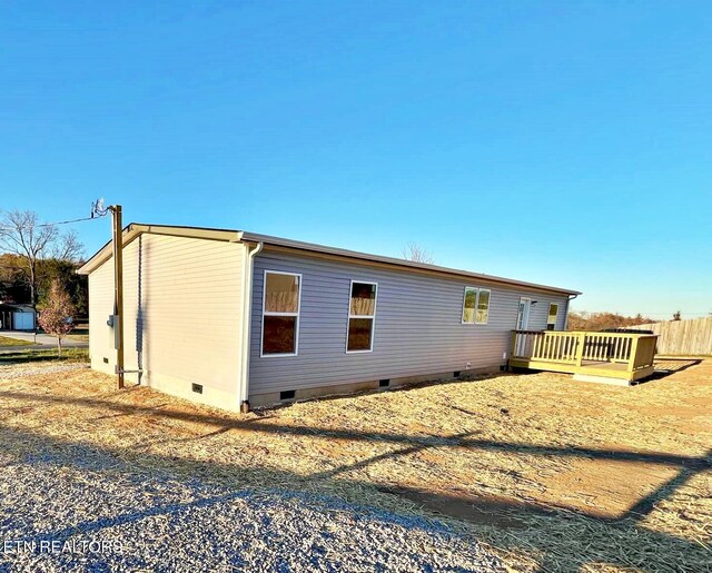 exterior space featuring a wooden deck