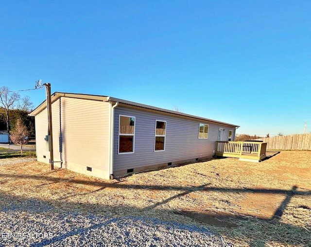 exterior space featuring a wooden deck