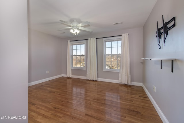 unfurnished room with wood-type flooring and ceiling fan