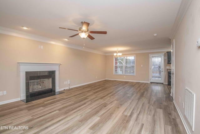 unfurnished living room featuring light hardwood / wood-style floors, ceiling fan with notable chandelier, and ornamental molding