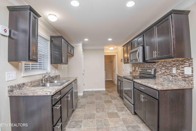 kitchen featuring backsplash, crown molding, sink, dark brown cabinetry, and stainless steel appliances