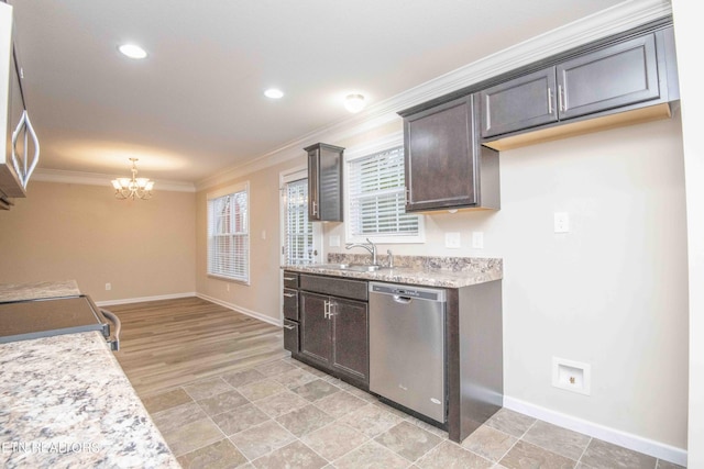 kitchen featuring an inviting chandelier, sink, ornamental molding, appliances with stainless steel finishes, and dark brown cabinetry