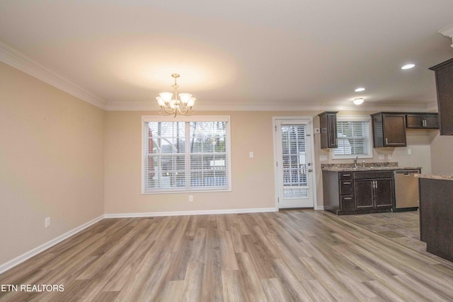 kitchen featuring dishwasher, dark brown cabinets, light hardwood / wood-style flooring, and ornamental molding