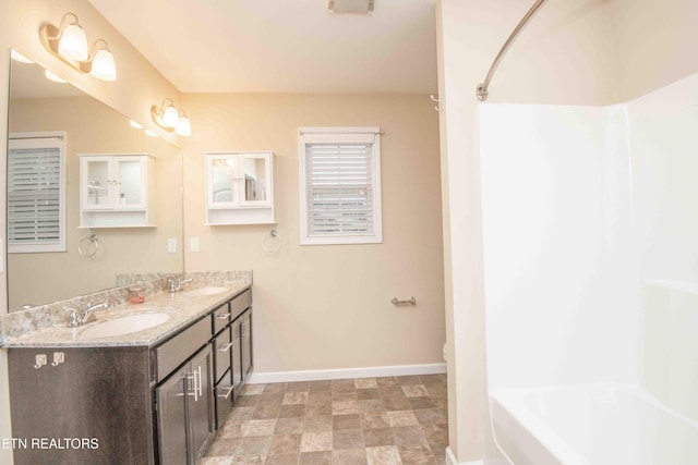 full bathroom with vanity, shower / bathtub combination, and toilet