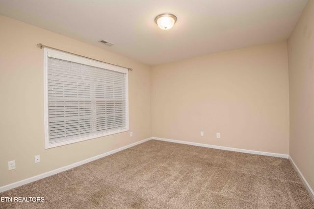 empty room featuring carpet floors