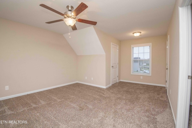 additional living space with carpet floors, ceiling fan, and lofted ceiling