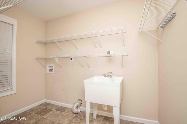 clothes washing area with electric dryer hookup and hookup for a washing machine