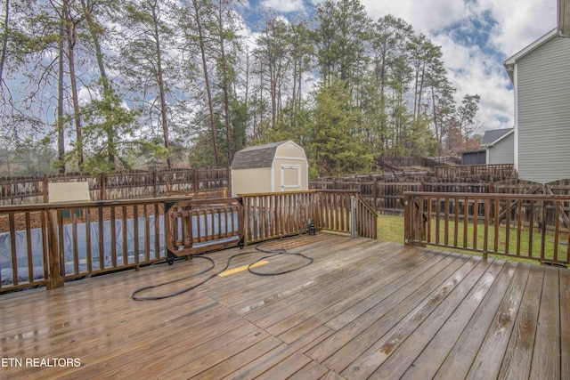 wooden deck with a shed