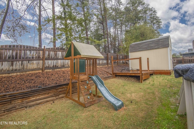 view of playground with a lawn