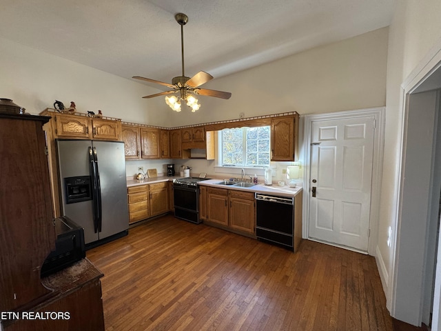 kitchen with stove, dark hardwood / wood-style flooring, sink, stainless steel fridge with ice dispenser, and black dishwasher