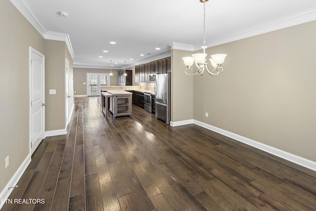 kitchen featuring pendant lighting, a center island, dark hardwood / wood-style flooring, and appliances with stainless steel finishes