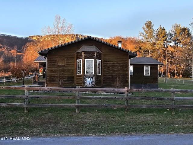 view of side of home featuring a mountain view