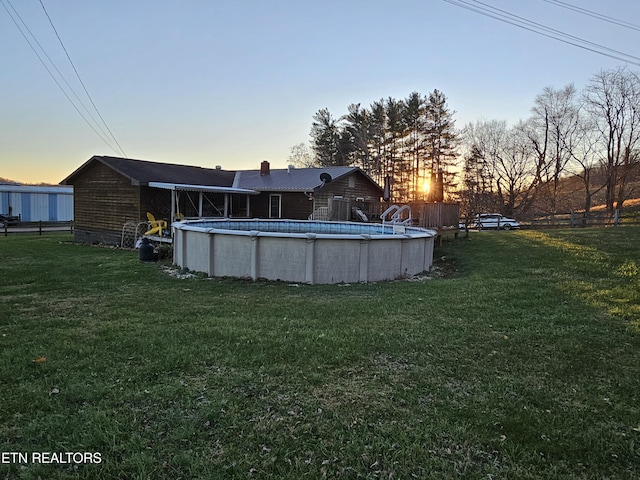 view of yard at dusk