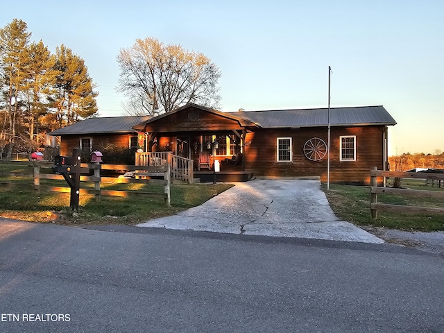 view of front facade with a yard and a porch