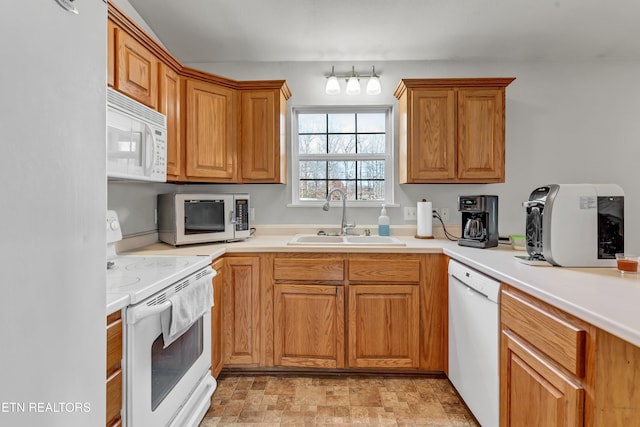 kitchen with sink and white appliances