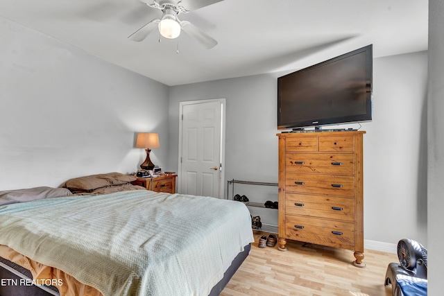 bedroom featuring ceiling fan and light hardwood / wood-style flooring