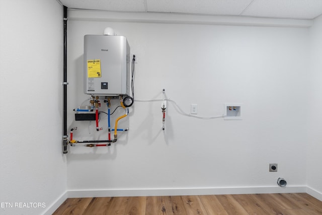 utility room with tankless water heater