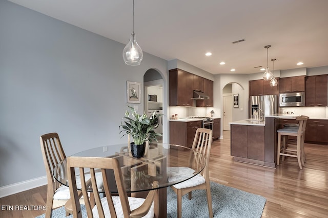 dining room featuring light hardwood / wood-style floors