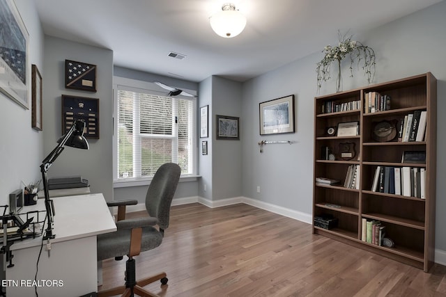 office with hardwood / wood-style floors