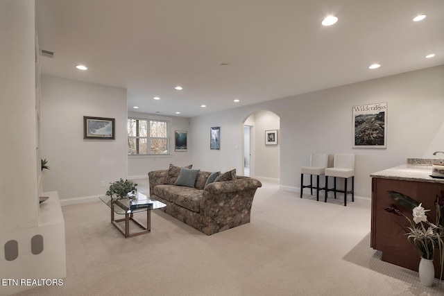 living room featuring light colored carpet