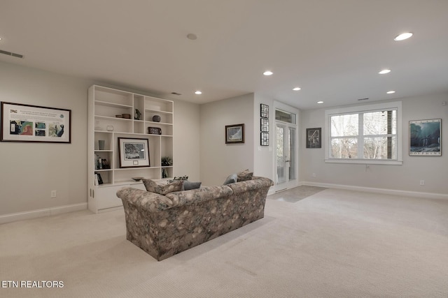 living room featuring light colored carpet