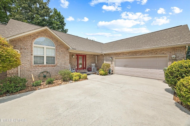 single story home featuring a garage