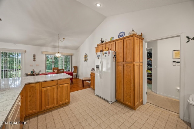 kitchen with white refrigerator with ice dispenser, vaulted ceiling, stainless steel dishwasher, light stone countertops, and decorative light fixtures