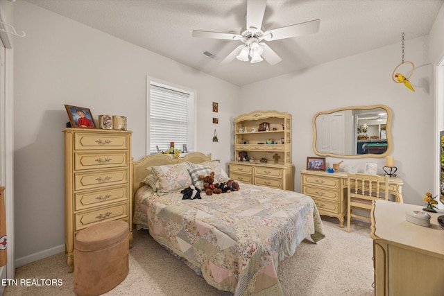 bedroom featuring a textured ceiling and ceiling fan