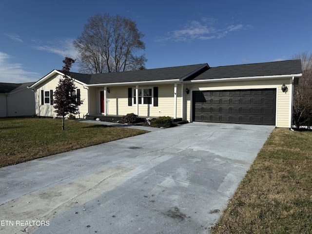 single story home featuring a garage and a front lawn