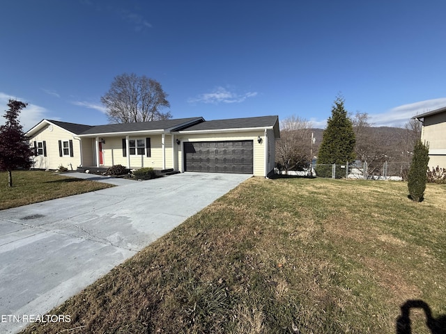 single story home with a front yard and a garage