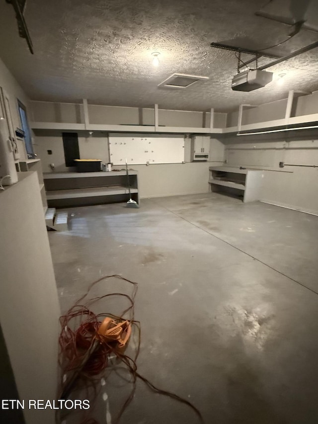 basement featuring a textured ceiling