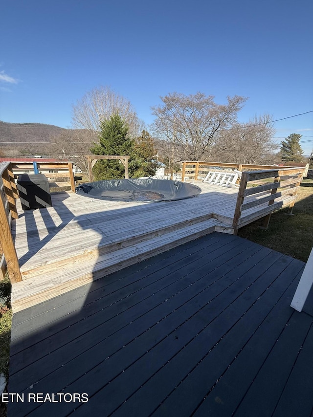 wooden terrace with a mountain view