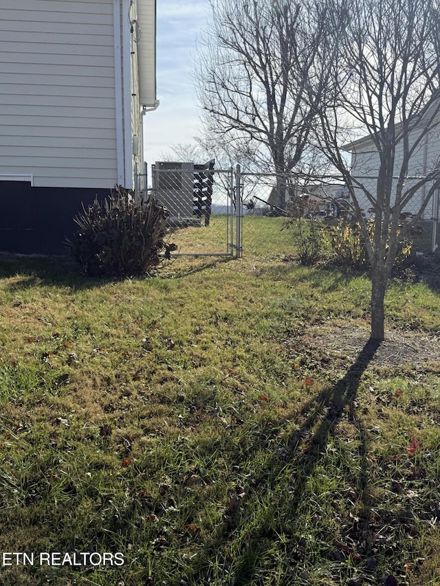 view of yard with central AC