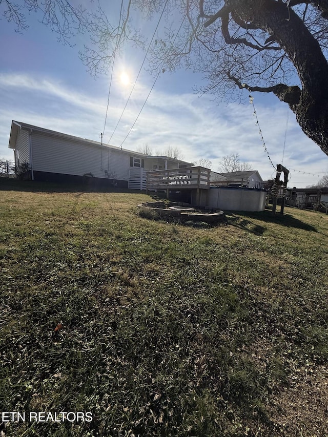 view of yard with a deck