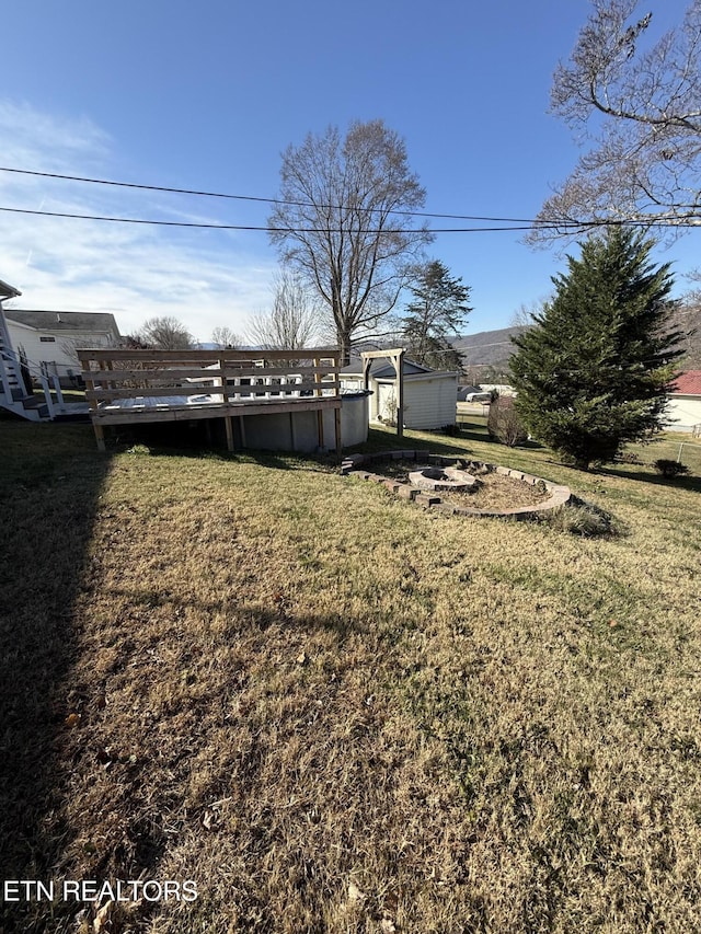 view of yard with a deck