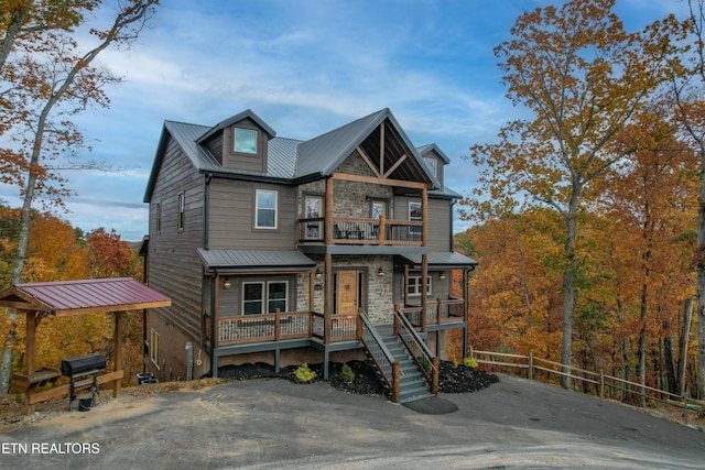 view of front of house with a balcony