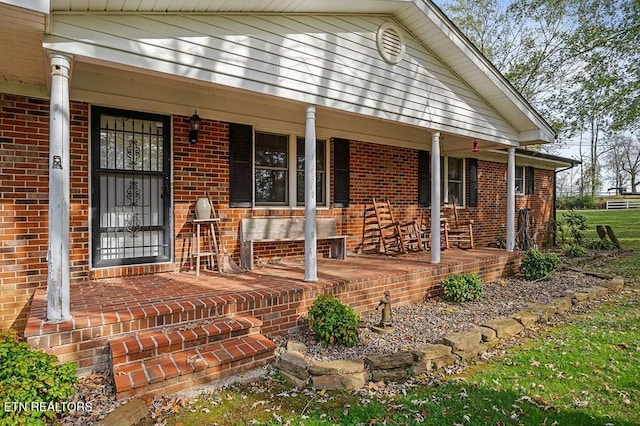 entrance to property with covered porch