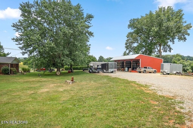 view of yard with an outdoor structure