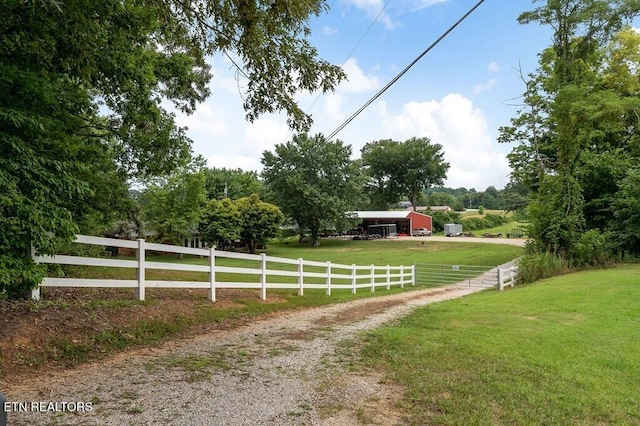 exterior space with an outbuilding and a rural view