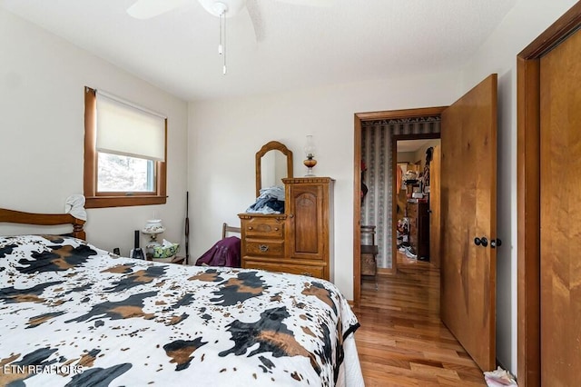 bedroom featuring light wood-type flooring and ceiling fan