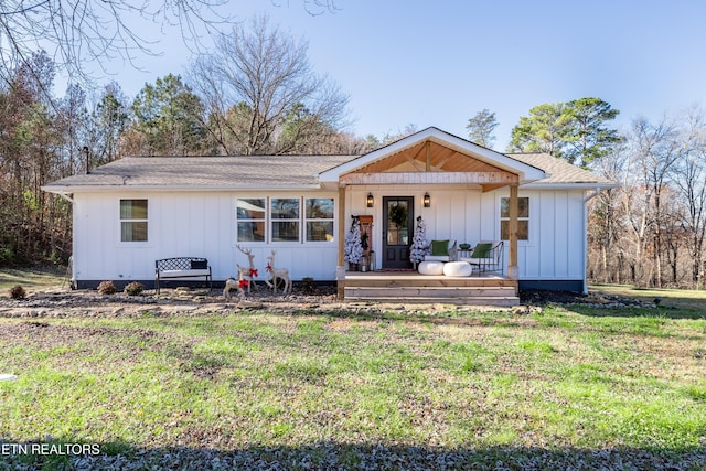 view of front of house with a front lawn and a porch