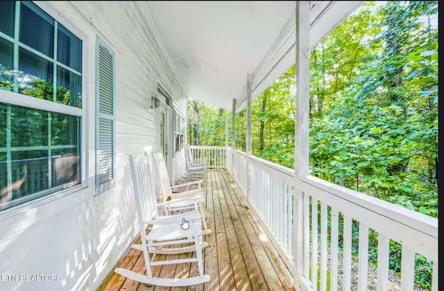 wooden terrace featuring a porch