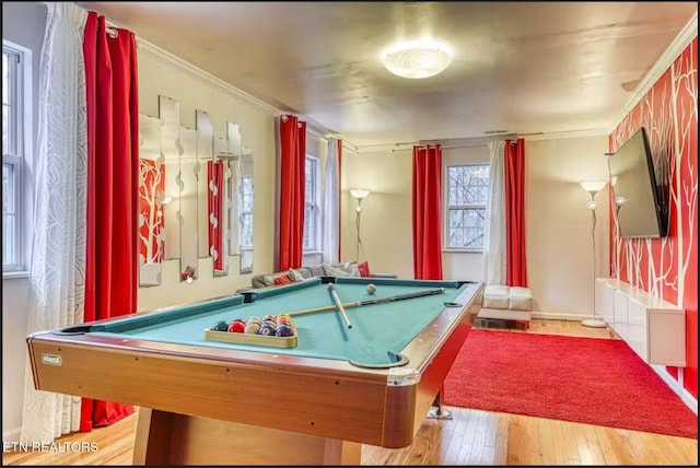 rec room featuring light hardwood / wood-style flooring, pool table, and ornamental molding