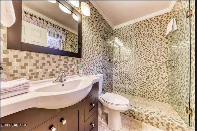 bathroom featuring crown molding, an enclosed shower, decorative backsplash, vanity, and tile walls