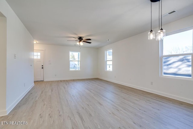 spare room featuring ceiling fan and light hardwood / wood-style floors