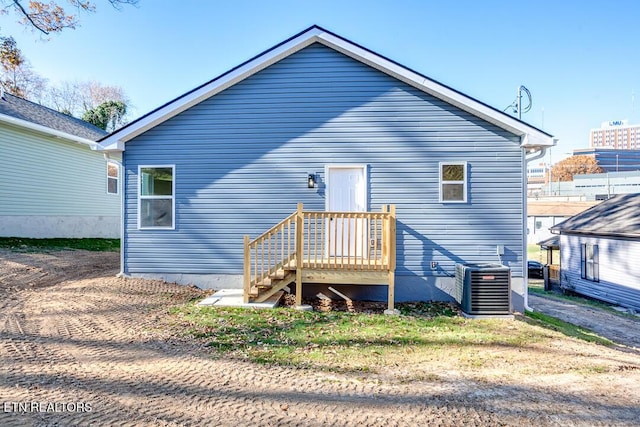 rear view of house with central AC unit