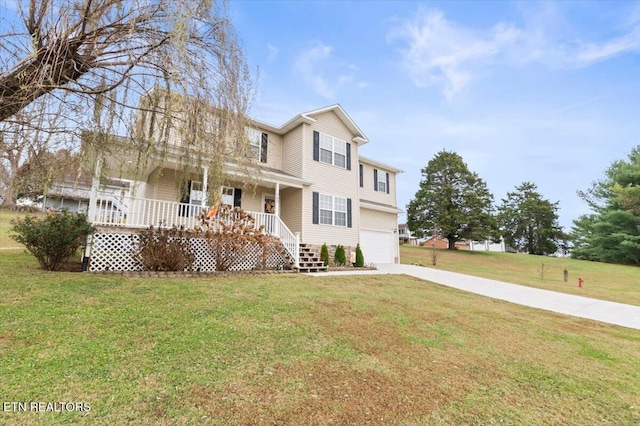 view of front of home featuring covered porch, a garage, and a front yard